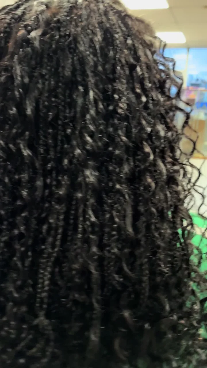 Boho braids with loose curls created at Lorie’s salon