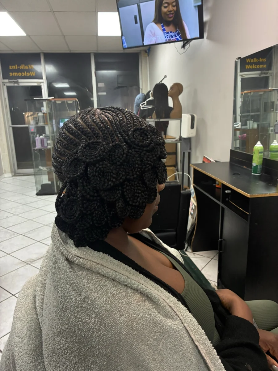 Intricate braided updo photographed at Lorie’s salon